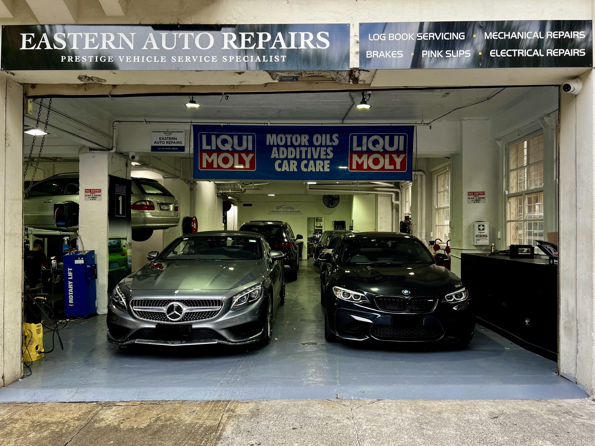 Eastern Auto Repairs workshop front on Hardie Street, with a Mercedes-Benz and a BMW inside