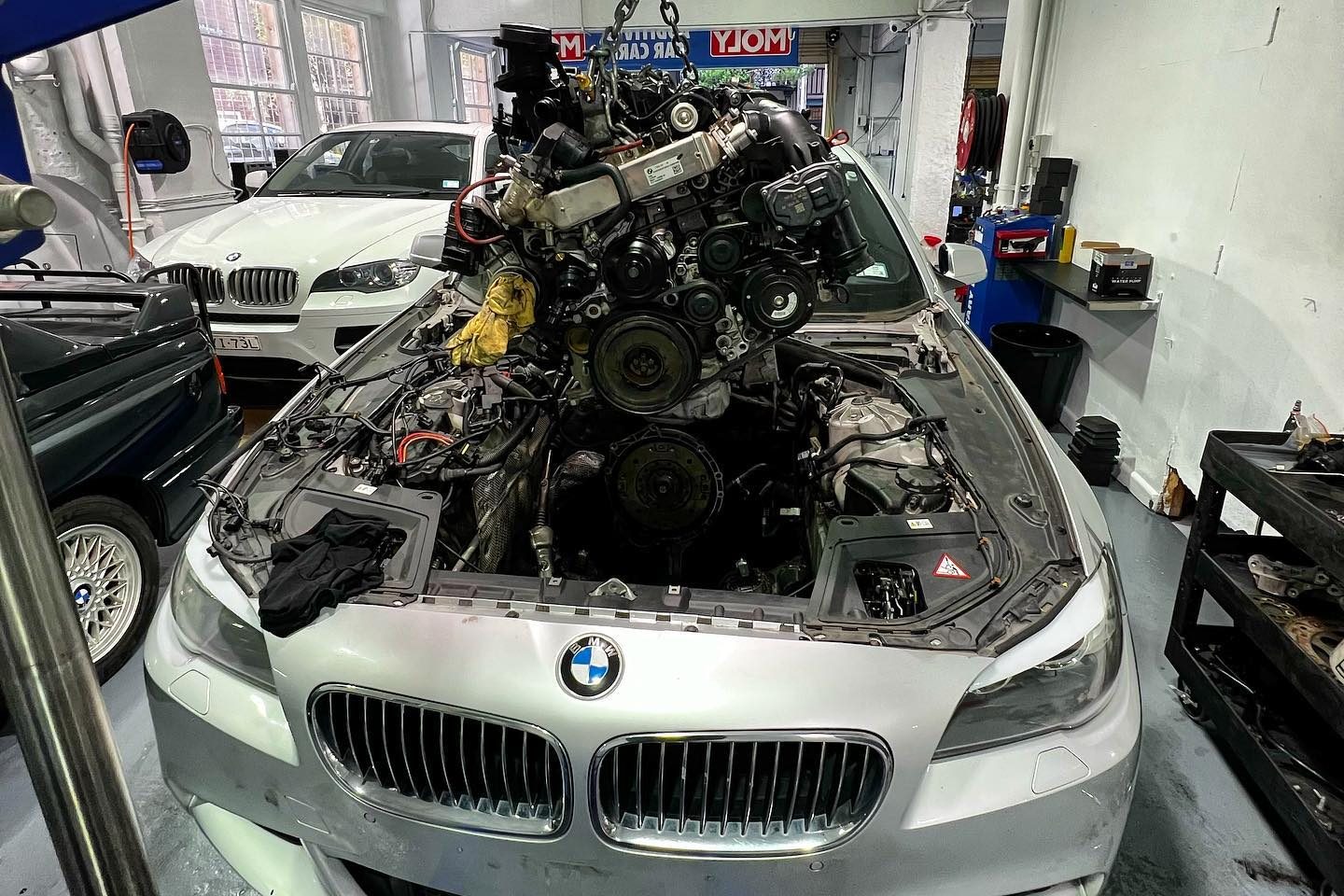 BMW raised on the two-post hoist